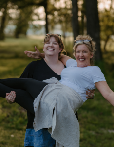 Mandy and Lauren from The Empty Nest Mom laughing over coffee while shopping together — a fun mom-and-daughter duo sharing their favorite finds.