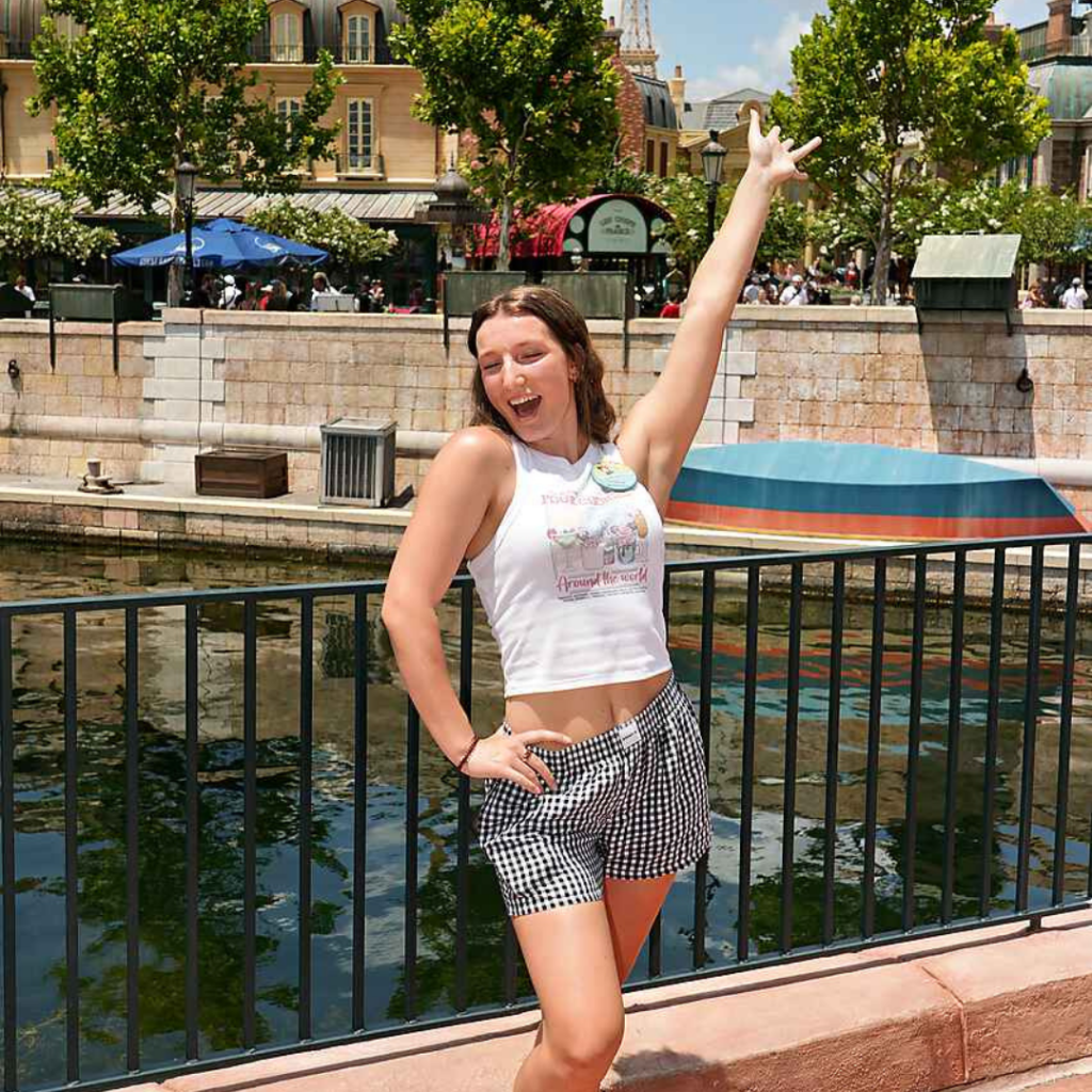 Gracie arms up at Epcot enjoying her Bday