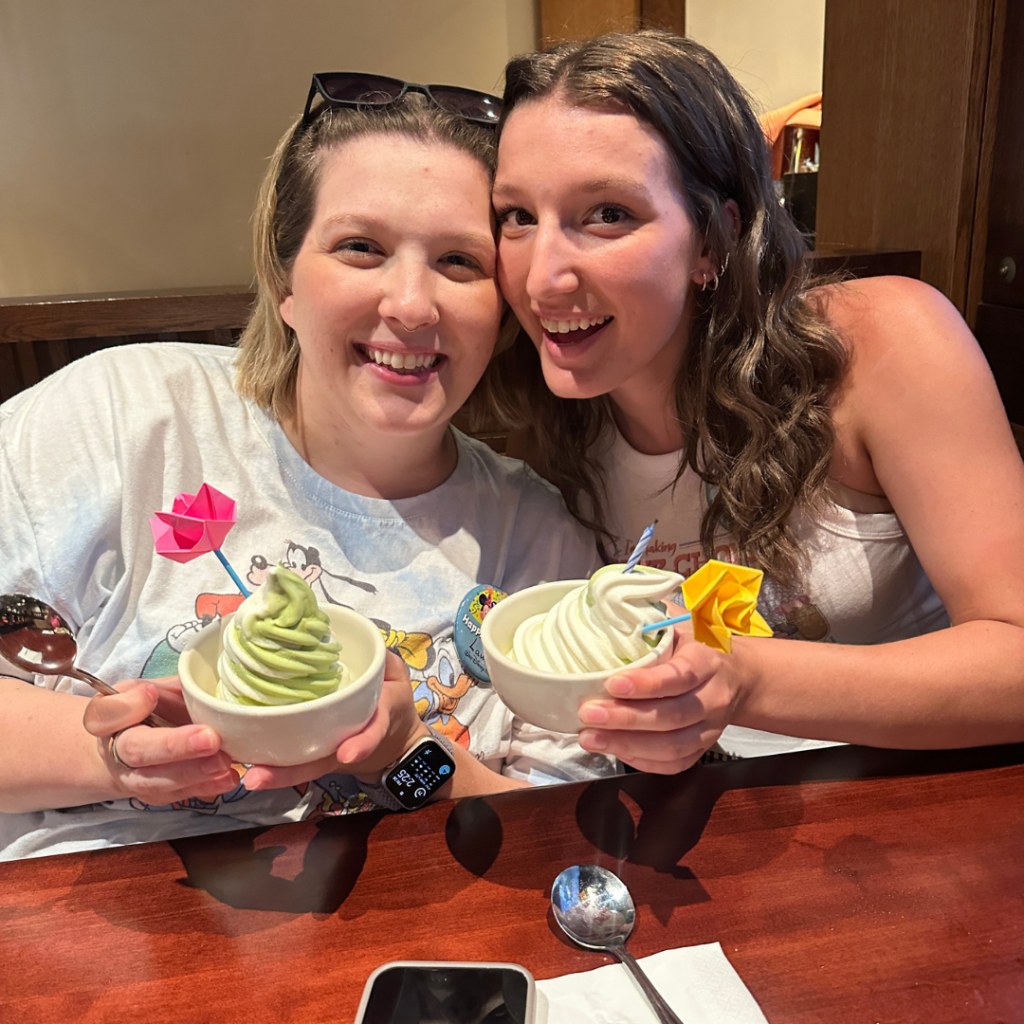 Lauren and Gracie eating their Birthday dessert in Japan at Epcot