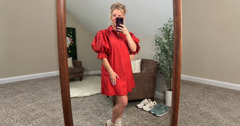 Mandy taking a mirror selfie in the red dress that helped her feel like herself again.