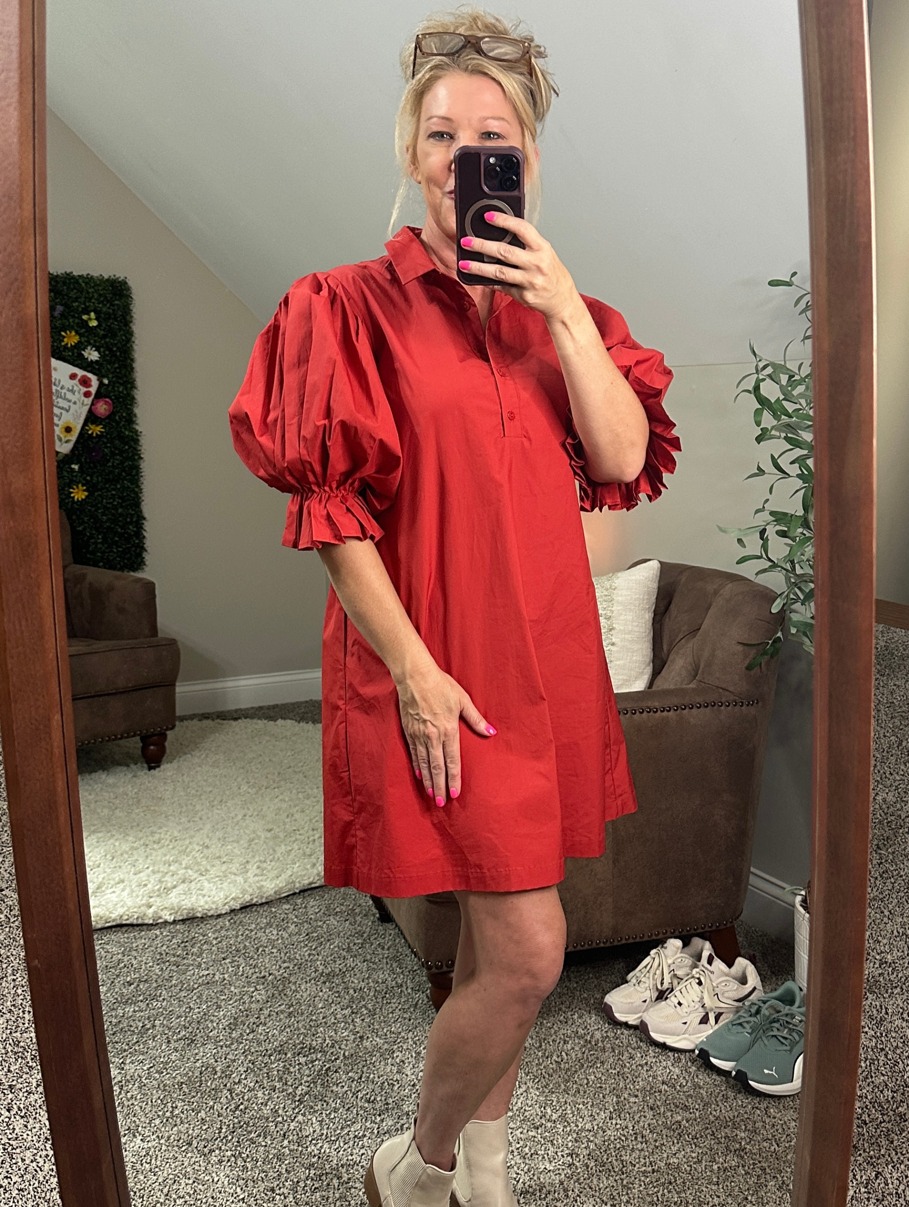 Mandy taking a mirror selfie in the red dress that helped her feel like herself again.